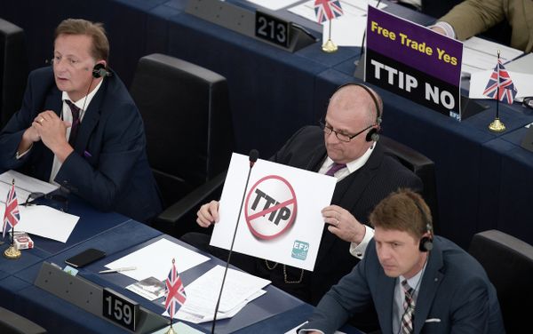 Members of the European Parliament take part in a voting session as they hold signs against the Transatlantic Trade and Investment Partnership (TTIP), on June 10, 2015, in the European Parliament in Strasbourg, eastern France Members of the European Parliament take part in a voting session as they hold signs against the Transatlantic Trade and Investment Partnership (TTIP), on June 10, 2015, in the European Parliament in Strasbourg, eastern France - Sputnik International