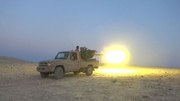 This picture released on July 12, 2015 by the Rased News Network, a Facebook page affiliated with Islamic State militants, shows an Islamic State militant fires a heavy weapon during a battle against Syrian government forces, in Homs province, Syria This picture released on July 12, 2015 by the Rased News Network, a Facebook page affiliated with Islamic State militants, shows an Islamic State militant fires a heavy weapon during a battle against Syrian government forces, in Homs province, Syria - Sputnik International