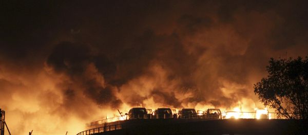 Vehicles are seen burning after blasts at Binhai new district in Tianjin municipality, China, August 13, 2015 Vehicles are seen burning after blasts at Binhai new district in Tianjin municipality, China, August 13, 2015 - Sputnik International