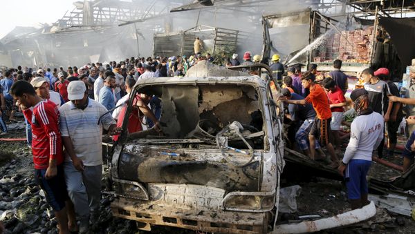 Residents gather at the site of a truck bomb attack at a crowded market in Baghdad ,August 13,2015 Residents gather at the site of a truck bomb attack at a crowded market in Baghdad ,August 13,2015 - Sputnik International