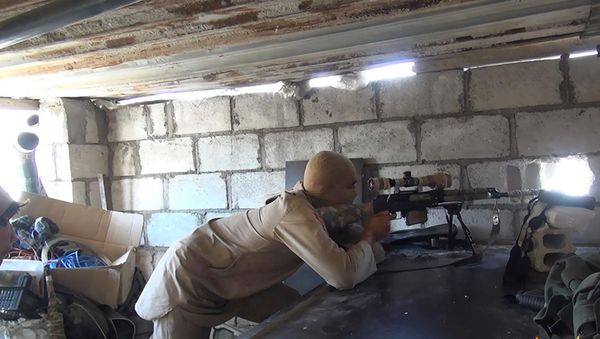 This picture released on July 13, 2015 by the Rased News Network, a Facebook page affiliated with Islamic State militants, shows an Islamic State militant sniper in position during a battle against Syrian government forces, in Deir el-Zour province, Syria This picture released on July 13, 2015 by the Rased News Network, a Facebook page affiliated with Islamic State militants, shows an Islamic State militant sniper in position during a battle against Syrian government forces, in Deir el-Zour province, Syria - Sputnik International