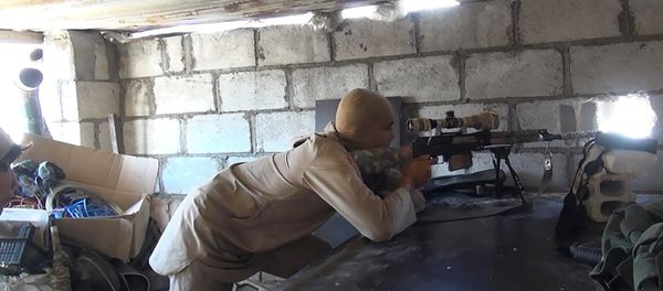 This picture released on July 13, 2015 by the Rased News Network, a Facebook page affiliated with Islamic State militants, shows an Islamic State militant sniper in position during a battle against Syrian government forces, in Deir el-Zour province, Syria This picture released on July 13, 2015 by the Rased News Network, a Facebook page affiliated with Islamic State militants, shows an Islamic State militant sniper in position during a battle against Syrian government forces, in Deir el-Zour province, Syria - Sputnik International
