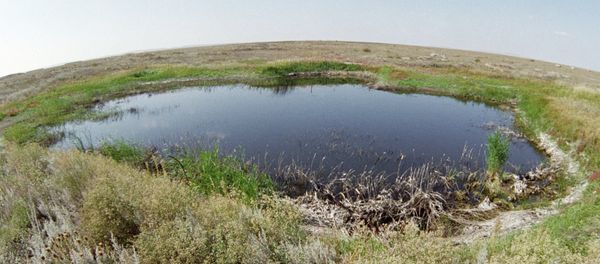 A lake in the place of a surface nuclear explosion on the Semipalatinsk proving ground A lake in the place of a surface nuclear explosion on the Semipalatinsk proving ground - Sputnik International