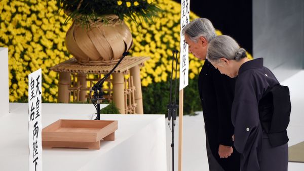 Emperor Akihito (L) and Empress Michiko (R) offer silence prayers before the altar during the annual memorial service for war victims in Tokyo on August 15, 2015 Emperor Akihito (L) and Empress Michiko (R) offer silence prayers before the altar during the annual memorial service for war victims in Tokyo on August 15, 2015 - Sputnik International