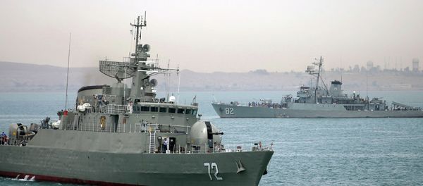 Iranian warship Alborz, foreground, prepares before leaving Iran's waters. - Sputnik International
