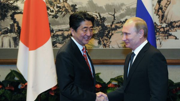 Russian President Vladimir Putin, right, and Japanese Prime Minister Shinzo Abe at their meeting held on the sidelines of the Asia-Pacific Economic Cooperation (APEC) summit in Beijing, November 9, 2014 Russian President Vladimir Putin, right, and Japanese Prime Minister Shinzo Abe at their meeting held on the sidelines of the Asia-Pacific Economic Cooperation (APEC) summit in Beijing, November 9, 2014 - Sputnik International