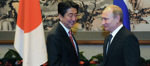 Russian President Vladimir Putin, right, and Japanese Prime Minister Shinzo Abe at their meeting held on the sidelines of the Asia-Pacific Economic Cooperation (APEC) summit in Beijing, November 9, 2014 Russian President Vladimir Putin, right, and Japanese Prime Minister Shinzo Abe at their meeting held on the sidelines of the Asia-Pacific Economic Cooperation (APEC) summit in Beijing, November 9, 2014 - Sputnik International