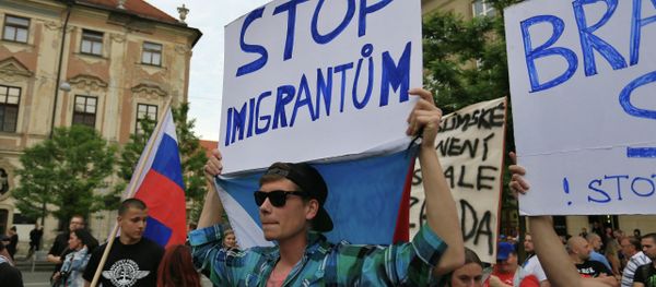 Anti-migrants protesters hold banners reading 'Stop Immigration' on June 26, 2015 in Brno, Czech Republic during an anti-Islam and immigration rally Anti-migrants protesters hold banners reading 'Stop Immigration' on June 26, 2015 in Brno, Czech Republic during an anti-Islam and immigration rally - Sputnik International
