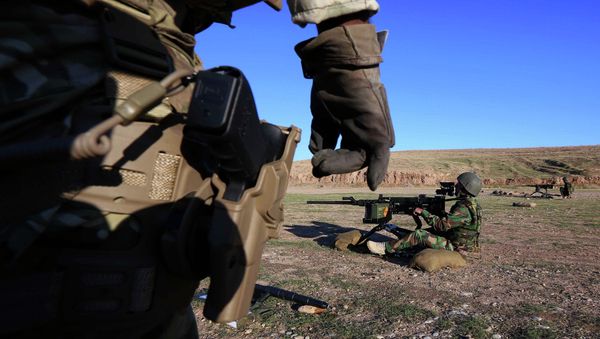 British military advisers instruct Kurdish Peshmerga fighters during a training session at a shooting range on the outskirts of Arbil, the capital of the autonomous Kurdish region of northern Iraq British military advisers instruct Kurdish Peshmerga fighters during a training session at a shooting range on the outskirts of Arbil, the capital of the autonomous Kurdish region of northern Iraq - Sputnik International