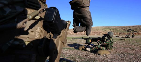 British military advisers instruct Kurdish Peshmerga fighters during a training session at a shooting range on the outskirts of Arbil, the capital of the autonomous Kurdish region of northern Iraq - Sputnik International