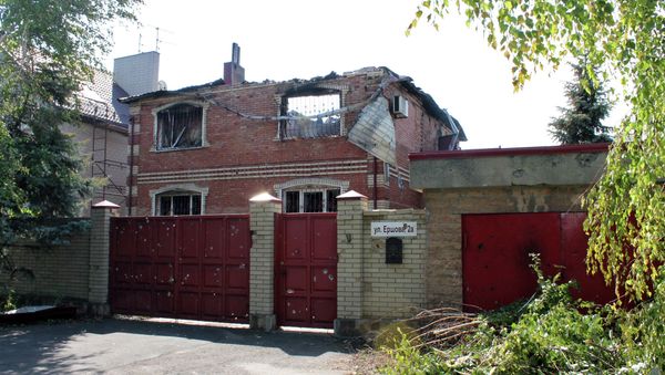 A building destroyed by shelling of the Oktyabrsky village in the Kuibyshevsky district of Donetsk - Sputnik International