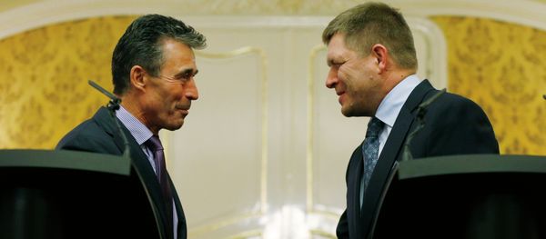 NATO Secretary General Anders Fogh Rasmussen, left, shake hands with Slovakia's Prime Minister Robert Fico as they meet in Bratislava, Slovakia, Thursday, May 15, 2014 - Sputnik International