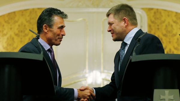 NATO Secretary General Anders Fogh Rasmussen, left, shake hands with Slovakia's Prime Minister Robert Fico as they meet in Bratislava, Slovakia, Thursday, May 15, 2014 NATO Secretary General Anders Fogh Rasmussen, left, shake hands with Slovakia's Prime Minister Robert Fico as they meet in Bratislava, Slovakia, Thursday, May 15, 2014 - Sputnik International