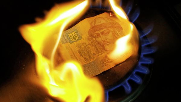 A burning one hryvnia bill on a gas burner A burning one hryvnia bill on a gas burner - Sputnik International