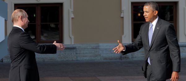 Russia's President Vladimir Putin, left, reaches out to shake hands with U.S. President Barack Obama during arrivals for the G-20 summit at the Konstantin Palace in St. Petersburg, Russia on Thursday, Sept. 5, 2013 - Sputnik International