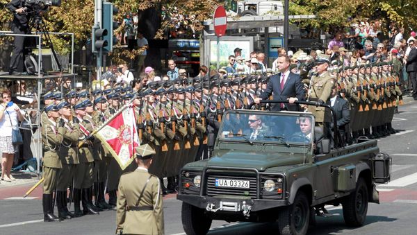 Polish President Andrzej Duda and Chief of Staff Gen. Mieczyslaw Gocul review troops prior to a military parade during Armed Forces Day in Warsaw, Poland August 15, 2015 - Sputnik International