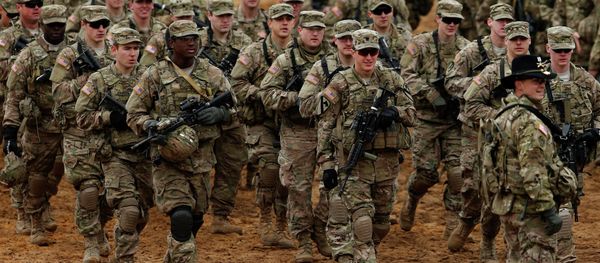 Members of the US Army B Company, 2nd Battalion, 8th Cavalry Regiment, 1st Brigade Combat Team, 1st Cavalry Division attend a military exercise 'Iron Sword 2014', at the Gaiziunu Training Range in Pabrade some 60km.(38 miles) north of the capital Vilnius, Lithuania Members of the US Army B Company, 2nd Battalion, 8th Cavalry Regiment, 1st Brigade Combat Team, 1st Cavalry Division attend a military exercise 'Iron Sword 2014', at the Gaiziunu Training Range in Pabrade some 60km.(38 miles) north of the capital Vilnius, Lithuania - Sputnik International
