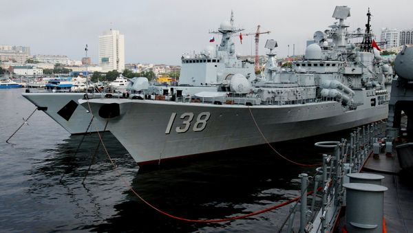 From left: The destroyers Shenyang and Taizhou that have arrived in Vladivostok together with five other Chinese warships for the second stage of the Naval Cooperation 2015 exercise - Sputnik International