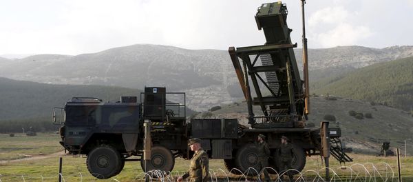 Soldiers of the German armed forces Bundeswehr stand next to the Patriot system before the arrival of Germany's Chancellor Angela Merkel at a Turkish military base in Kahramanmaras in this February 24, 2013 - Sputnik International