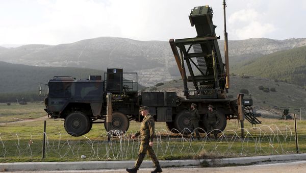 Soldiers of the German armed forces Bundeswehr stand next to the Patriot system before the arrival of Germany's Chancellor Angela Merkel at a Turkish military base in Kahramanmaras in this February 24, 2013 Soldiers of the German armed forces Bundeswehr stand next to the Patriot system before the arrival of Germany's Chancellor Angela Merkel at a Turkish military base in Kahramanmaras in this February 24, 2013 - Sputnik International