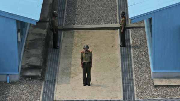 North Korean soldiers stand guard prior to a reunification rally in the border village of Panmunjom at the DMZ in North Korea, Saturday, Aug. 15, 2015. North Korean soldiers stand guard prior to a reunification rally in the border village of Panmunjom at the DMZ in North Korea, Saturday, Aug. 15, 2015. - Sputnik International