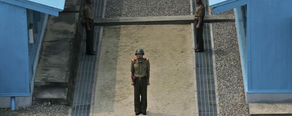 North Korean soldiers stand guard prior to a reunification rally in the border village of Panmunjom at the DMZ in North Korea, Saturday, Aug. 15, 2015. North Korean soldiers stand guard prior to a reunification rally in the border village of Panmunjom at the DMZ in North Korea, Saturday, Aug. 15, 2015. - Sputnik International
