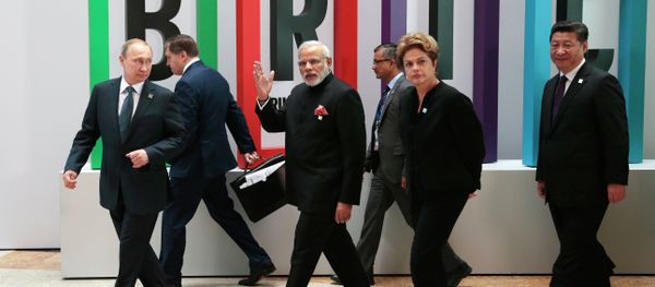 From left in front row: Russian President Vladimir Putin, Indian Prime Minister Narendra Modi, Brazilian President Dilma Rousseff, Chinese President Xi Jinping walk for a plenary session during the summit in Ufa, Russia, Thursday, July 9, 2015 - Sputnik International