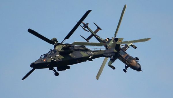Eurocopter Tiger H61 helicopters perform their demonstration flight during the 50th Paris Air Show at Le Bourget airport, north of Paris, Thursday, June 20, 2013 - Sputnik International