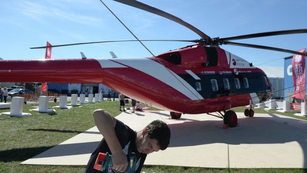 A MAKS 2015 participant prepares a Mi-38-2 helicopter for a flight program at the MAKS 2015 International Aviation and Space Salon A MAKS 2015 participant prepares a Mi-38-2 helicopter for a flight program at the MAKS 2015 International Aviation and Space Salon - Sputnik International