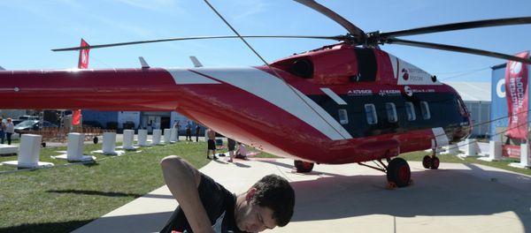 A MAKS 2015 participant prepares a Mi-38-2 helicopter for a flight program at the MAKS 2015 International Aviation and Space Salon A MAKS 2015 participant prepares a Mi-38-2 helicopter for a flight program at the MAKS 2015 International Aviation and Space Salon - Sputnik International