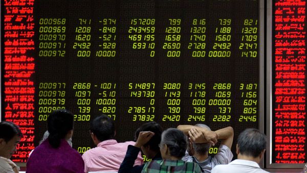 Investors monitor stock prices at a brokerage in Beijing, Friday, Aug. 21, 2015 Investors monitor stock prices at a brokerage in Beijing, Friday, Aug. 21, 2015 - Sputnik International