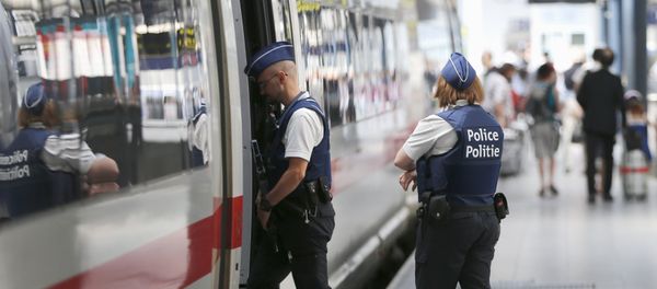 Belgian police officers enter a train during a patrol at the Thalys high-speed train terminal at Brussels Midi/Zuid railway station Belgian police officers enter a train during a patrol at the Thalys high-speed train terminal at Brussels Midi/Zuid railway station - Sputnik International
