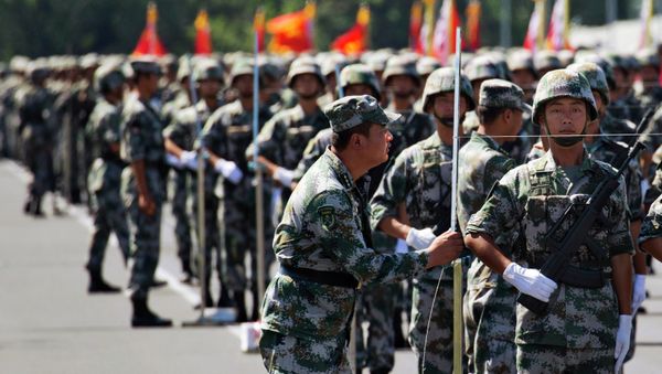 A Chinese soldier aligns troops with a string as they practice marching ahead of a Sept. 3 military parade at a camp on the outskirts of Beijing, Saturday, Aug. 22, 2015 - Sputnik International