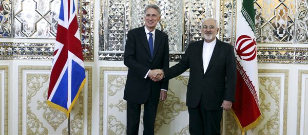 Britain's Foreign Secretary Philip Hammond (L) shakes hands with his Iranian counterpart Mohammad Javad Zarif after a meeting at the Ministry of Foreign Affairs in Tehran August 23, 2015 Britain's Foreign Secretary Philip Hammond (L) shakes hands with his Iranian counterpart Mohammad Javad Zarif after a meeting at the Ministry of Foreign Affairs in Tehran August 23, 2015 - Sputnik International
