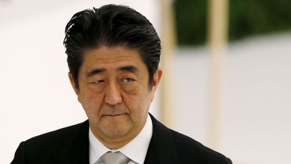 Japan's Prime Minister Shinzo Abe attends a memorial service ceremony marking the 70th anniversary of Japan's surrender in World War Two at Budokan Hall in Tokyo - Sputnik International