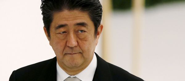 Japan's Prime Minister Shinzo Abe attends a memorial service ceremony marking the 70th anniversary of Japan's surrender in World War Two at Budokan Hall in Tokyo - Sputnik International