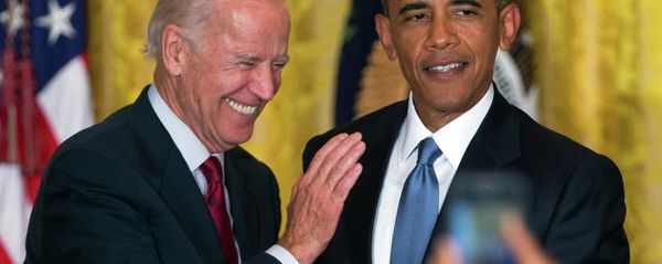Vice President Joe Biden and President Barack Obama react after a heckler is removed from the East Room of the White House. - Sputnik International