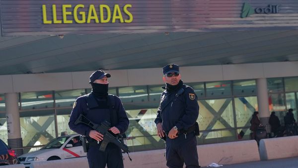 Police stand guard in front of teh Atocha train station in Madrid Police stand guard in front of teh Atocha train station in Madrid - Sputnik International