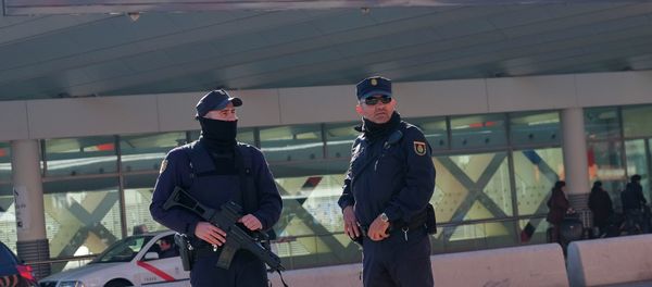 Police stand guard in front of teh Atocha train station in Madrid Police stand guard in front of teh Atocha train station in Madrid - Sputnik International