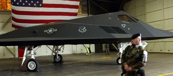 An US Air Force soldier patrol the perimetre around a F-117 Nighthawk stealth fighter jet An US Air Force soldier patrol the perimetre around a F-117 Nighthawk stealth fighter jet - Sputnik International