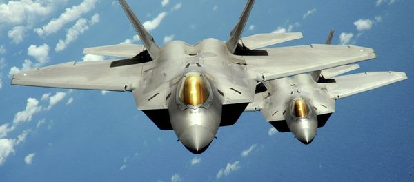 Two US Air Force F-22 Raptor stealth jet fighters fly near Andersen Air Force Base, Guam. File photo - Sputnik International