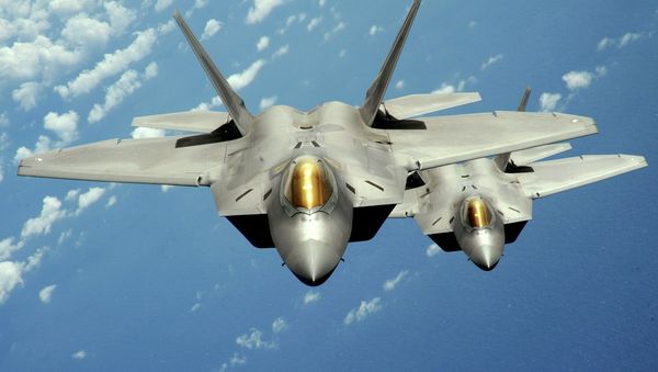 Two US Air Force F-22 Raptor stealth jet fighters fly near Andersen Air Force Base, Guam. File photo - Sputnik International