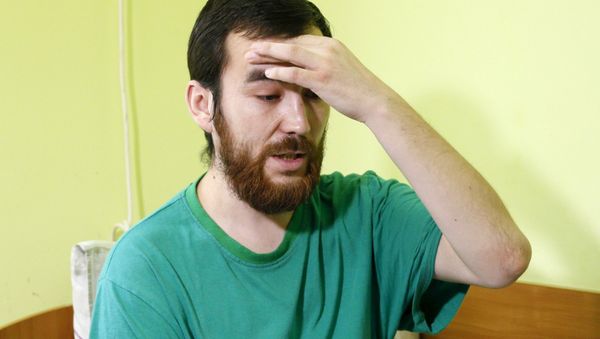 A man, who according to Ukraine's state security service (SBU) is named Yevgeny Yerofeyev and is one of two Russian servicemen detained on May 17 by Ukrainian forces, answers reporter's questions at a hospital in Kiev, Ukraine, July 28, 2015 - Sputnik International