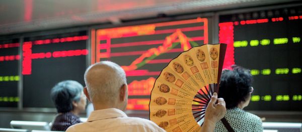 Investors look at screens showing stock market movements at a securities company in Beijing on July 28, 2015 Investors look at screens showing stock market movements at a securities company in Beijing on July 28, 2015 - Sputnik International