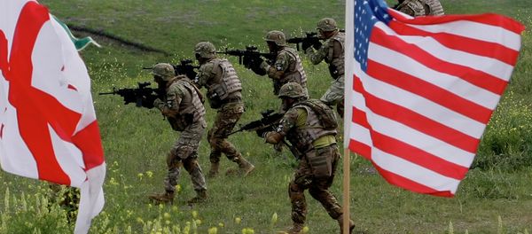 US and Georgian servicemen, with Georgian and US flags in front, take part in the joint US-Georgia military exercise at the Vaziani base outside the Georgian capital, Tbilisi, Georgia, Thursday, May 21, 2015 US and Georgian servicemen, with Georgian and US flags in front, take part in the joint US-Georgia military exercise at the Vaziani base outside the Georgian capital, Tbilisi, Georgia, Thursday, May 21, 2015 - Sputnik International