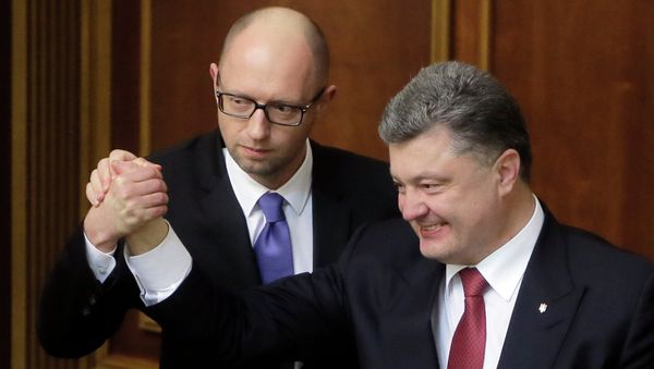 Ukraine's President Petro Poroshenko, right, and Prime Minister Arseniy Yatsenyuk celebrate after Yatsenyuk was appointed the Prime Minister during the opening first session of the Ukrainian parliament in Kiev, Ukraine Ukraine's President Petro Poroshenko, right, and Prime Minister Arseniy Yatsenyuk celebrate after Yatsenyuk was appointed the Prime Minister during the opening first session of the Ukrainian parliament in Kiev, Ukraine - Sputnik International