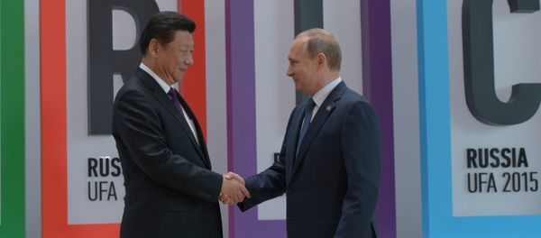 President of the Russian Federation Vladimir Putin, right, and President of the People’s Republic of China Xi Jinping at the welcome ceremony for the BRICS leaders in Ufa - Sputnik International
