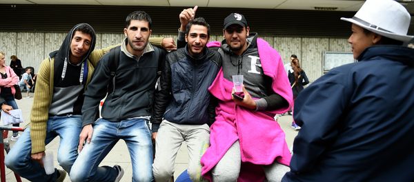 Syrian refugees queue outside outside the State Office of Health and Social Affairs in Berlin (LAGeSo) where hundreds of migrants wait to receive help from the Berlin administration on August 25, 2015 Syrian refugees queue outside outside the State Office of Health and Social Affairs in Berlin (LAGeSo) where hundreds of migrants wait to receive help from the Berlin administration on August 25, 2015 - Sputnik International
