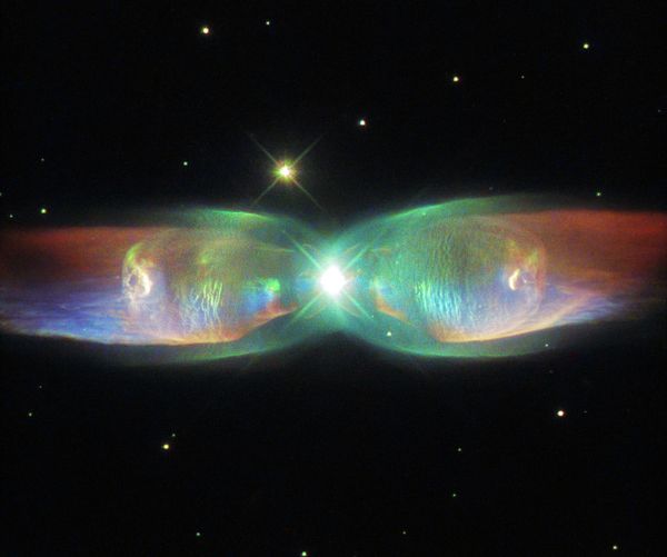 The shimmering colors visible in this NASA/ESA Hubble Space Telescope image show off the remarkable complexity of the Twin Jet Nebula. The shimmering colors visible in this NASA/ESA Hubble Space Telescope image show off the remarkable complexity of the Twin Jet Nebula. - Sputnik International