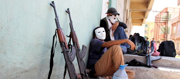 Masked members of YDG-H, youth wing of the outlawed Kurdistan Workers Party (PKK), sit next to their weapons in Silvan, near the southeastern city of Diyarbakir, Turkey, August 17, 2015 Masked members of YDG-H, youth wing of the outlawed Kurdistan Workers Party (PKK), sit next to their weapons in Silvan, near the southeastern city of Diyarbakir, Turkey, August 17, 2015 - Sputnik International